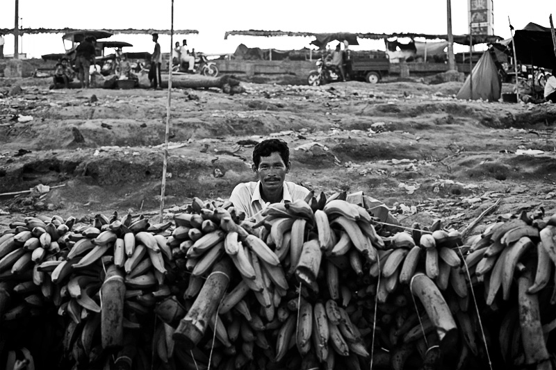 man behind bananas, pucallpa, peru, amazonia